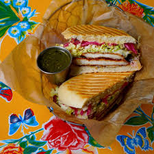 Xoco signature dishes Milanesa Torta
Carnitas Taco
Guacamole Almost Naked